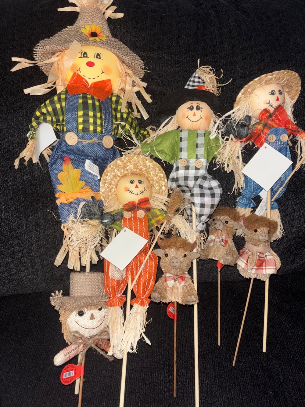Scarecrow family stick figures with cows